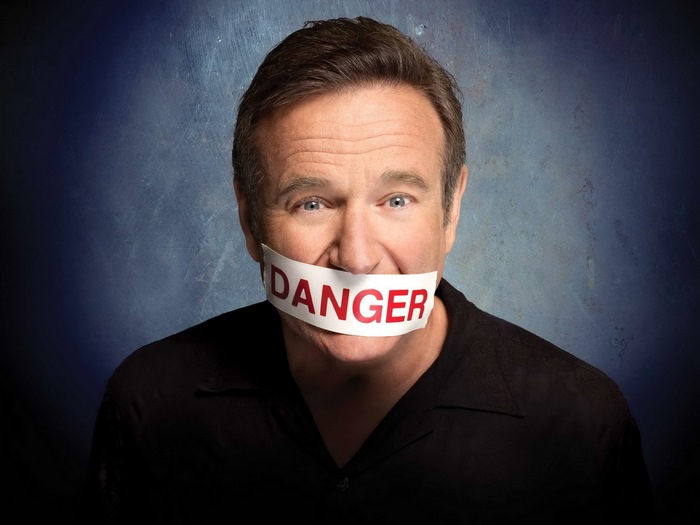 Robin Williams with Danger tape over mouth