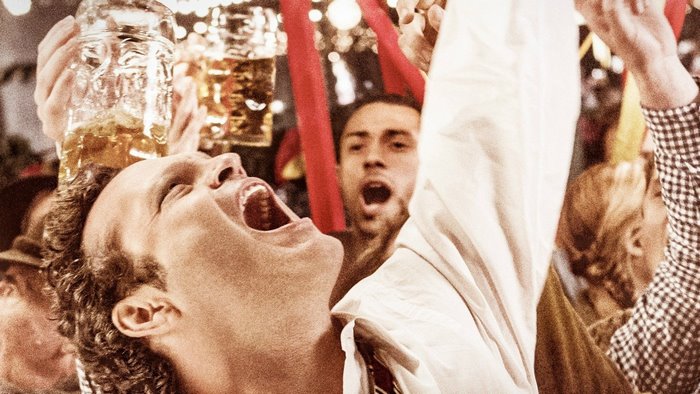 People celebrating with beer mugs