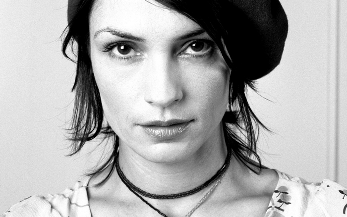 Famke Janssen wearing a beret