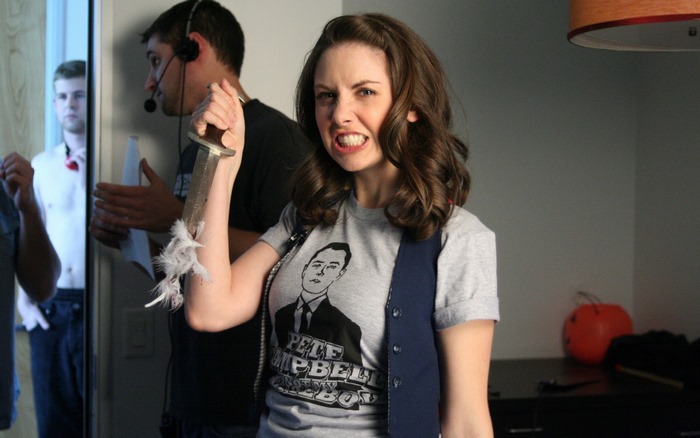 Alison Brie holding a knife