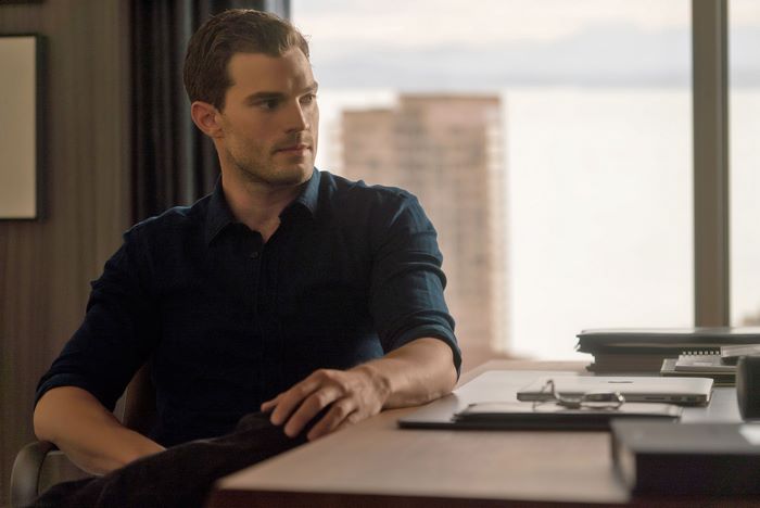 Jamie Dornan in an office setting