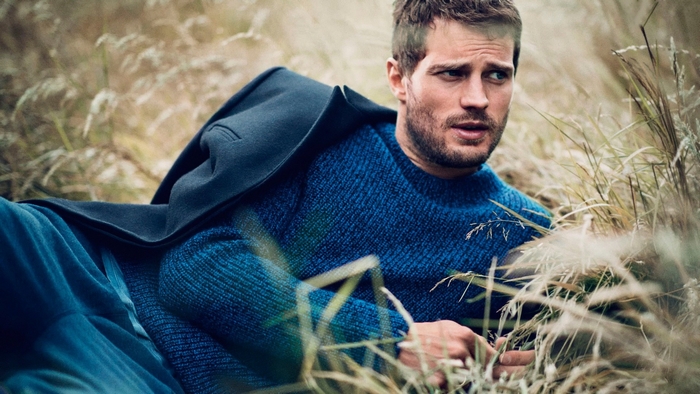 Jamie Dornan in a blue sweater and coat