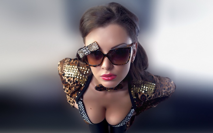 Woman in leopard print jacket and sunglasses