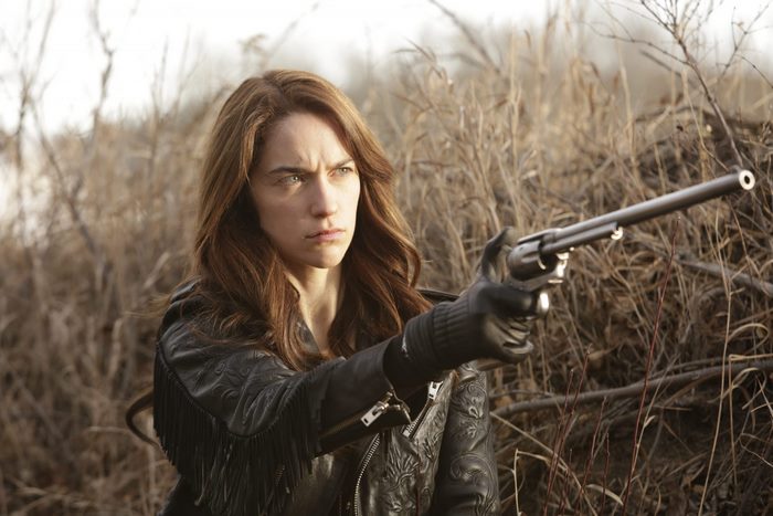 Melanie Scrofano holding a revolver