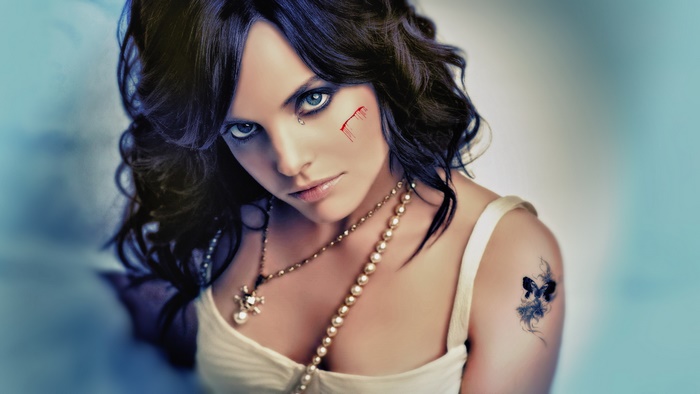 Mena Suvari Woman with Dark Hair and Tattoo
