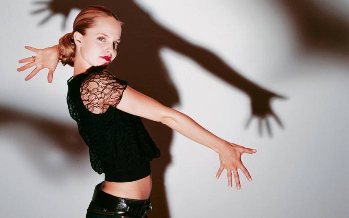 Mena Suvari Posing with Dramatic Shadow on Wall