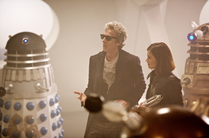 Peter Capaldi and Jenna Coleman with Daleks