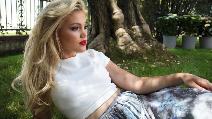 Olivia Holt in a garden