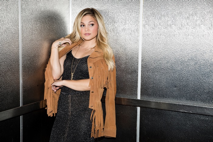 Olivia Holt in a fringed jacket