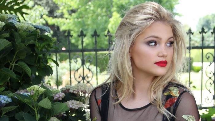 Olivia Holt posing outdoors