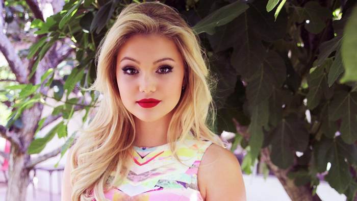 Olivia Holt posing outdoors