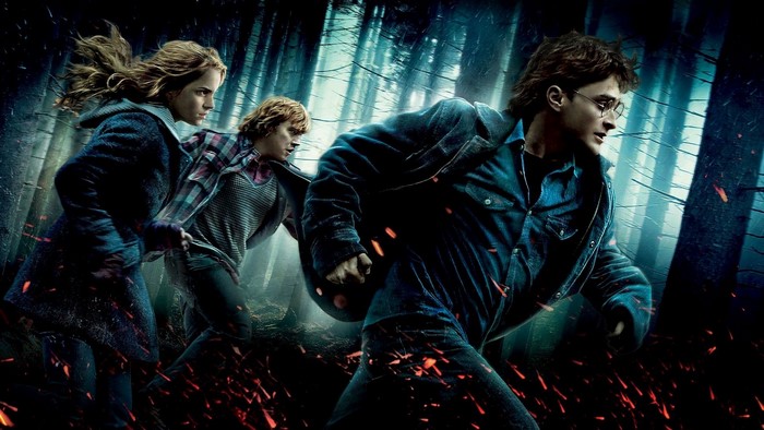 Harry Potter, Hermione Granger, and Ron Weasley running in a forest