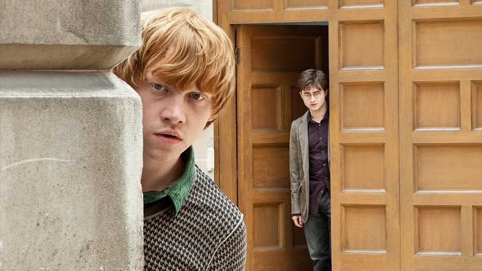 Rupert Grint and Daniel Radcliffe peeking