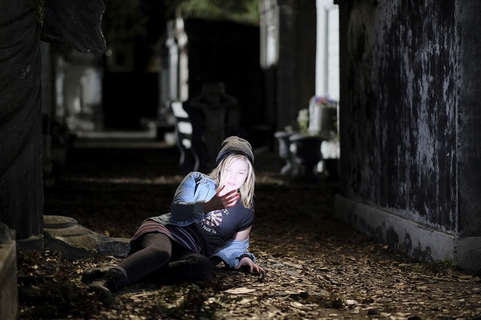 Olivia Holt in a graveyard