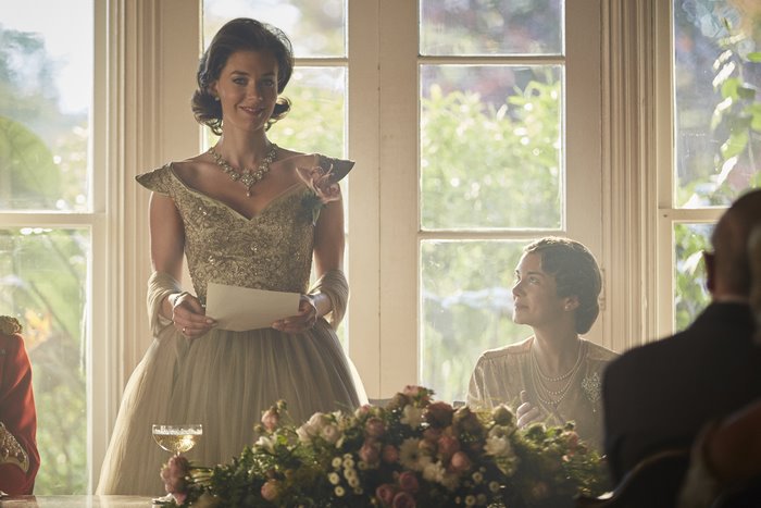 Vanessa Kirby in a formal gown at a table