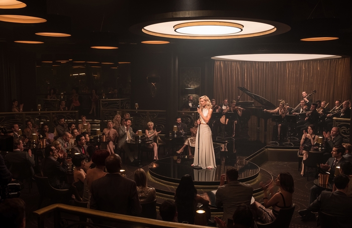 Vanessa Kirby performing in a nightclub