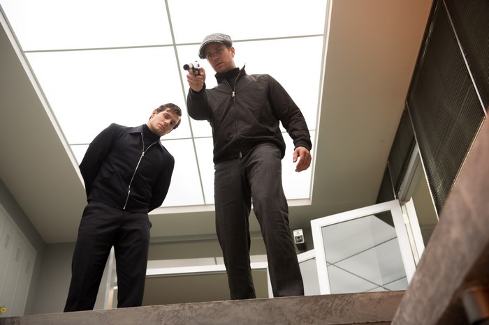 Armie Hammer with a gun
