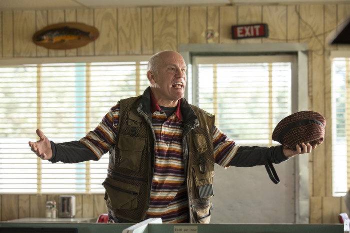 John Malkovich in a vest and hat