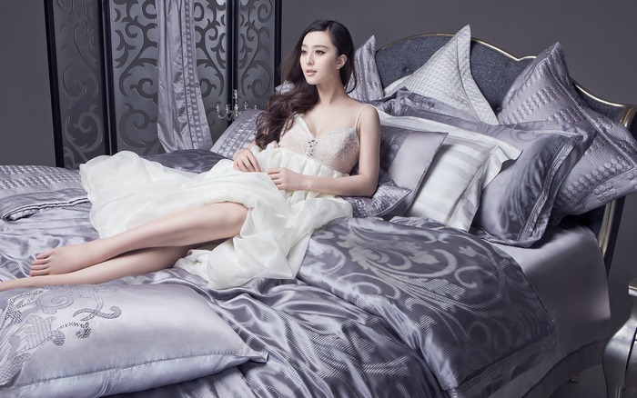 Elegant Fan Bingbing Relaxing on Luxurious Silver Bed