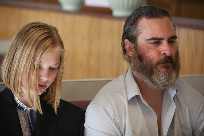 Joaquin Phoenix and a young girl