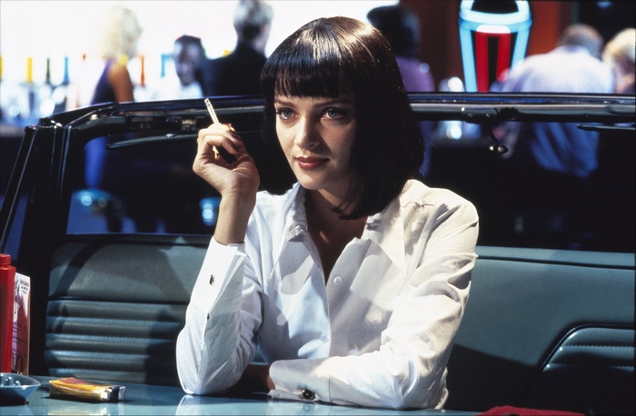 Uma Thurman smoking in a diner