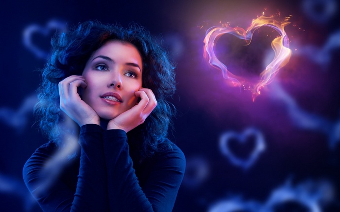 Woman looking at a fiery heart
