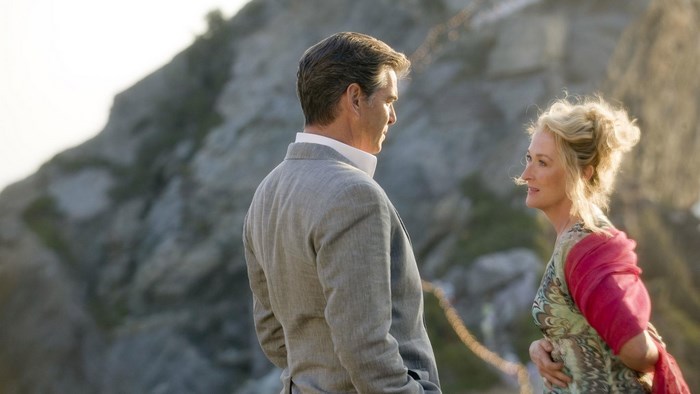 Pierce Brosnan and Meryl Streep on a rocky cliff