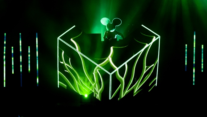Deadmau5 performing on stage with cube