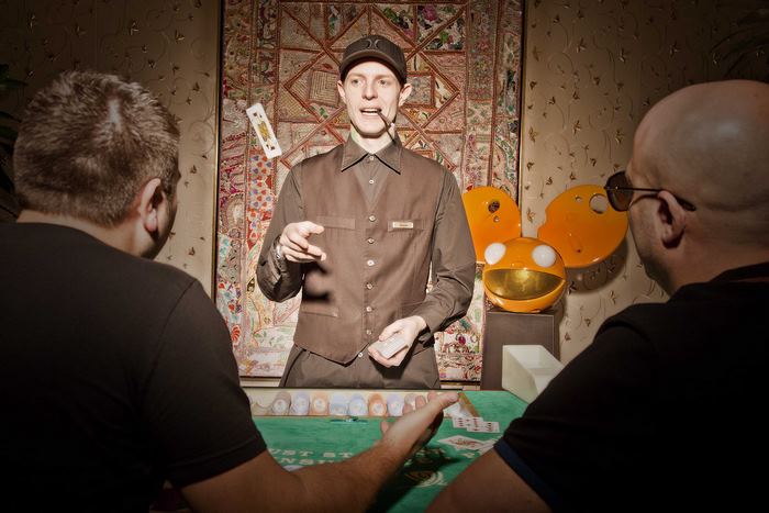 Joel Zimmerman performing magic trick with cards