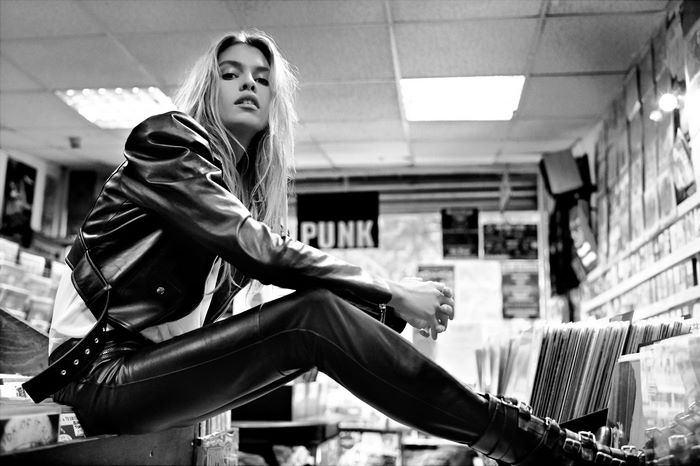 Stella Maxwell in a record store