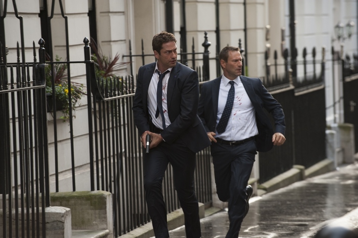 Two men running with guns
