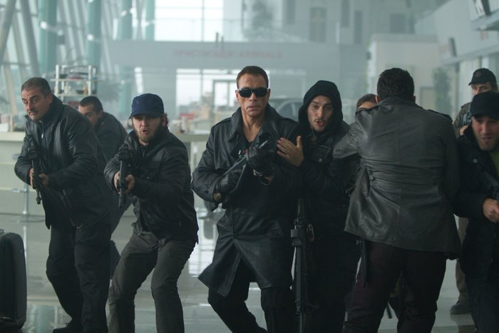 Jean-Claude Van Damme and armed men in airport