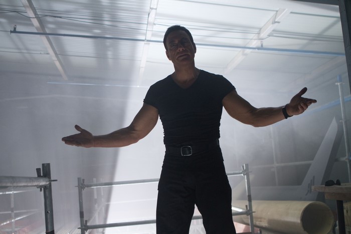 Jean-Claude Van Damme in a smoky industrial setting