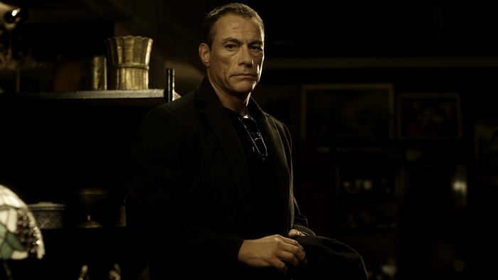 Jean-Claude Van Damme in a dark room