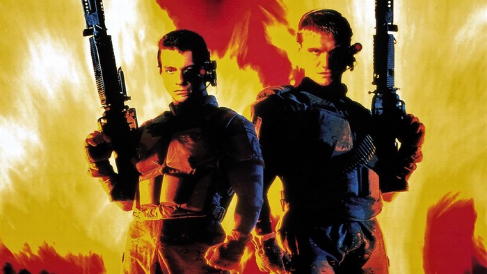 Jean-Claude Van Damme in a military uniform holding a rifle