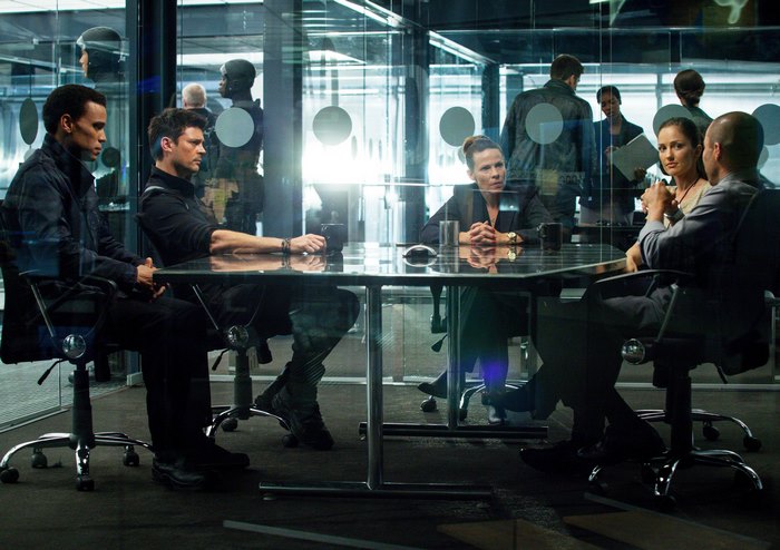 Karl Urban and others in a meeting room