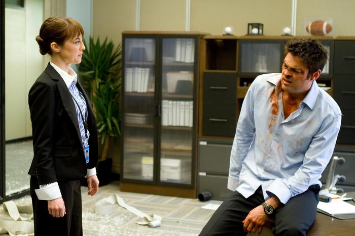 Karl Urban in an office setting