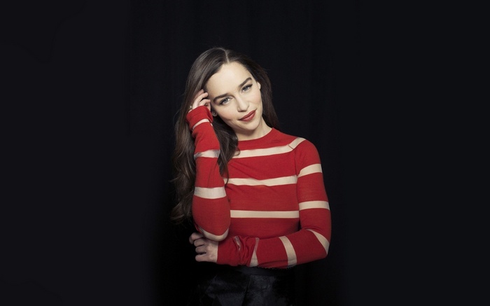 Emilia Clarke in a red and white striped sweater