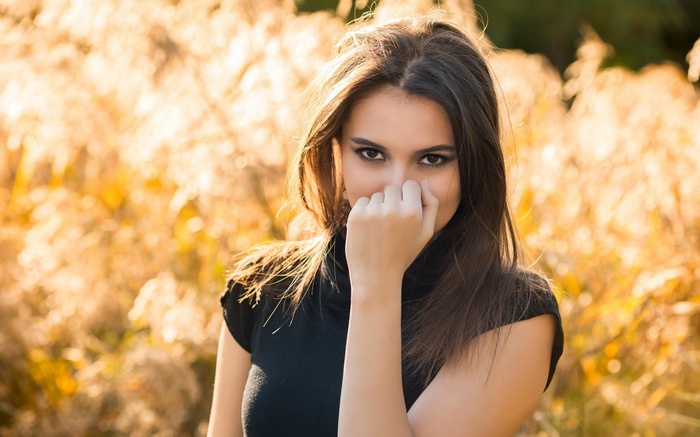 Woman in black turtleneck in a field