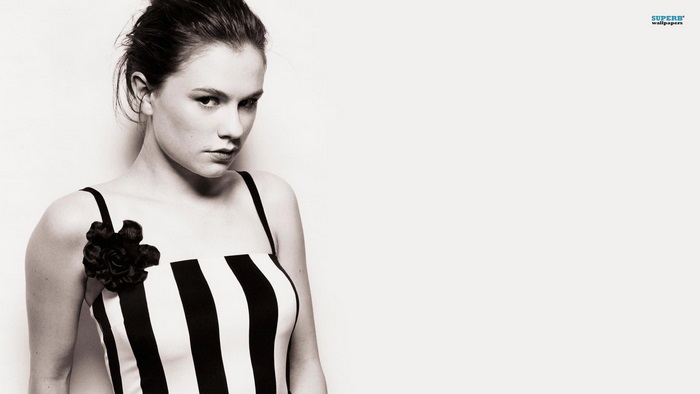Anna Paquin in a striped dress with a flower