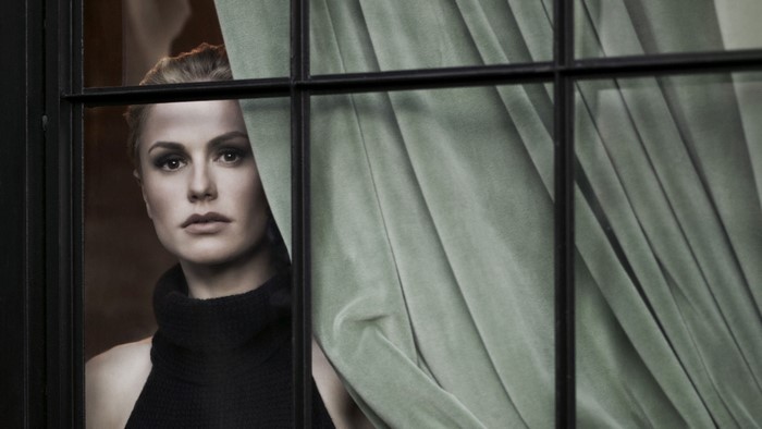 Anna Paquin looking through a window