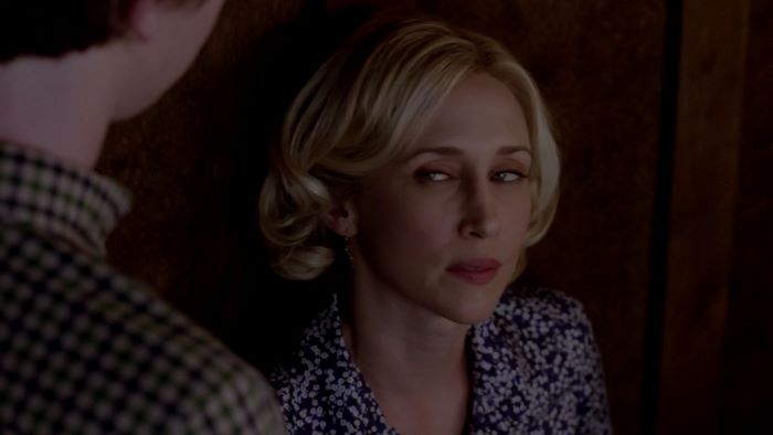 Vera Farmiga in a dark room