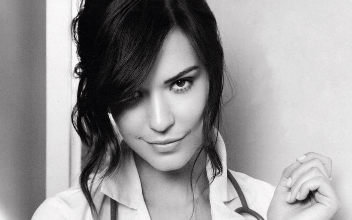 Odette Annable in a white shirt with a stethoscope