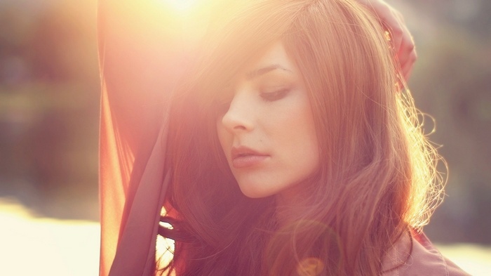 Woman with long hair in sunlight