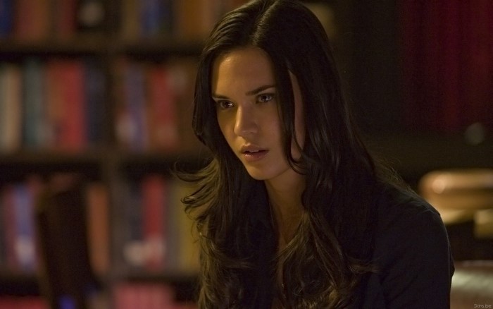 Odette Annable in a library