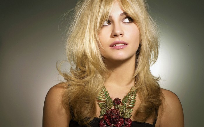 Pixie Lott wearing a floral necklace