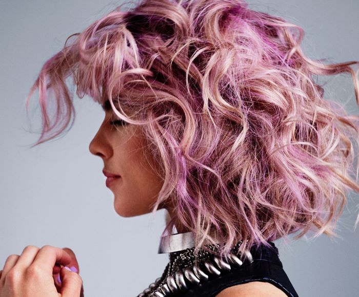 Emily Bett Rickards with pink and blonde curly hair