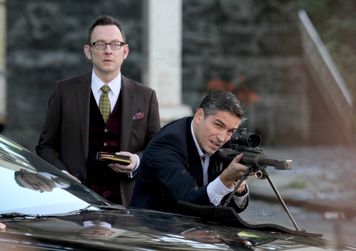 Michael Emerson with a sniper rifle