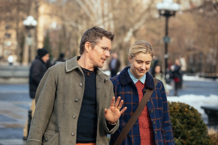 Ethan Hawke and Greta Gerwig walking in a park