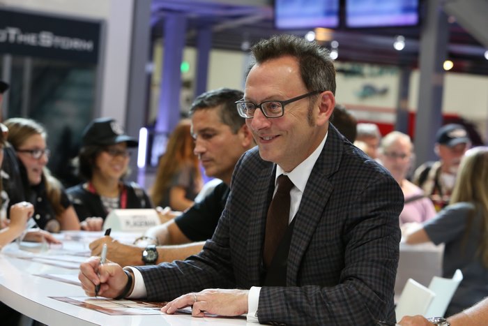 Michael Emerson signing autographs at a table